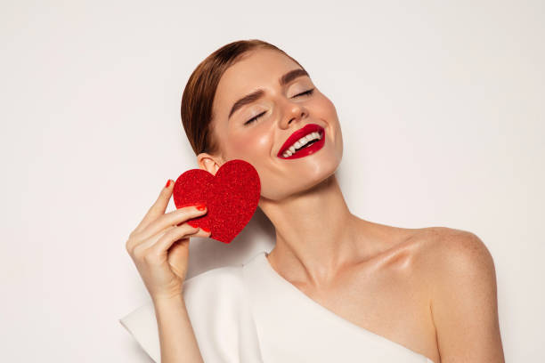 istock Beautiful emotional woman holding present box 1434204879