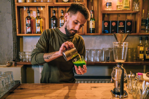 Barista preparing green colored coffee