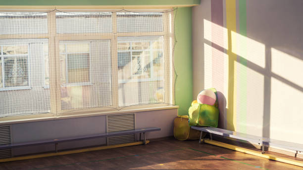 istock Empty playground indoor of gymnasium gym with protective net on window 1434206295