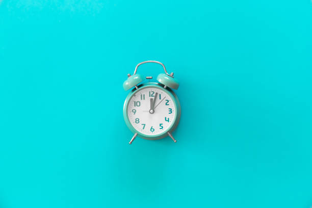 istock Blue alarm clock on blue background isolated, flat lay. 1434209090