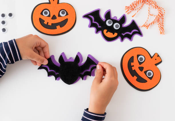 istock child making monster decoration for halloween holiday 1434210145