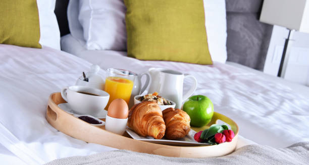 istock Breakfast on tray in bed in hotel room 1434211806