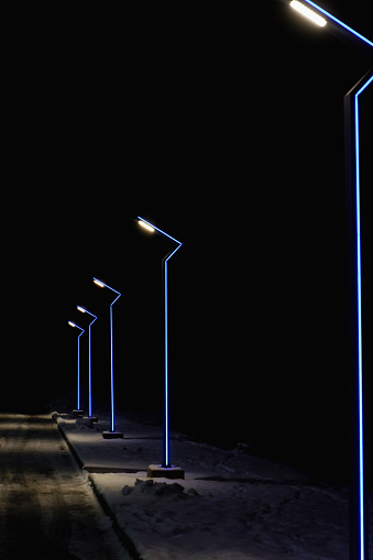 Modern lamppost with blue illumination. A modern looking street lamp post