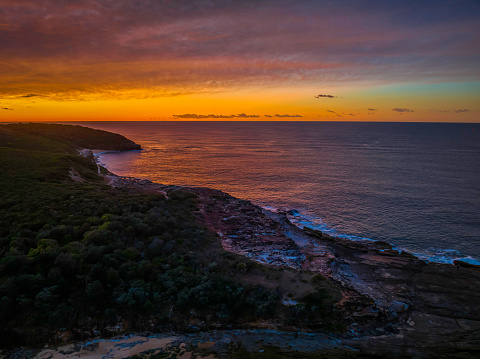 Sunrise with high cloud at Putty Beach on the Central Coast, NSW, Australia.