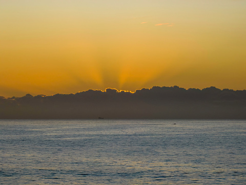 Sunrise over the ocean at Flat Rock beach nxt to the ocean baths in Newcastle, NSW, Australia.