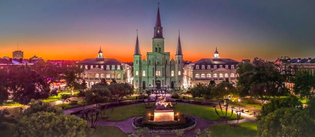 New Orleans Jackson square Jackson Square with St.Louis Cathedral at sunset.
In front of the Cathedral is a bronze statues of General Andrew Jackson.
sculpture was completed in December 1855 by artist Clark Mills new orleans stock pictures, royalty-free photos & images