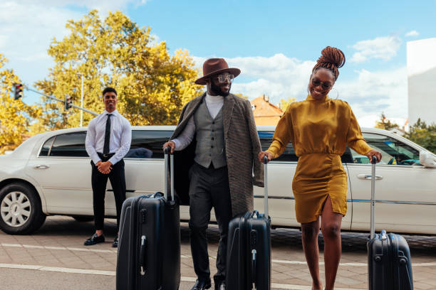 istock Wealthy couple leaving limousine. 1434224878