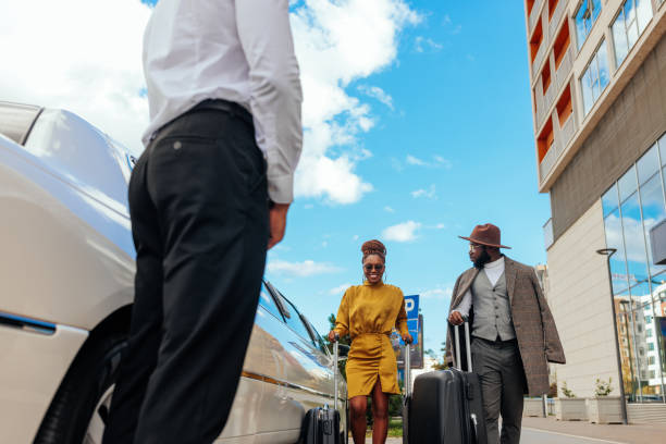 istock African American couple taking limo. 1434225099