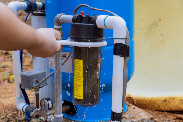 istock Replacement of replaceable filters is performed by professional worker for cleaning the water in the outside area of the home by the use of replaceable filters 1434226410