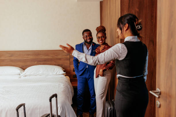 istock Concierge showing hotel guest around apartment. 1434226437