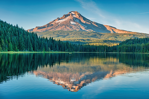 Landscape with Mount Hood reflecting in Trillium Lake in Oregon, USA at sunset.