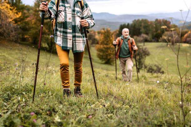 istock Senior couple climbing hill together 1434234550