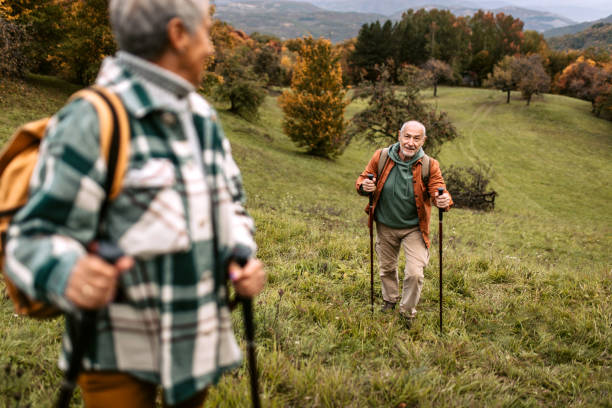 istock Senior couple climbing hill together 1434234639