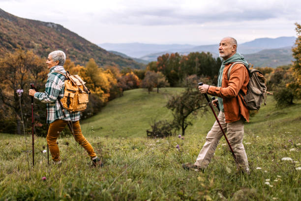 istock Senior couple climbing hill together 1434234702