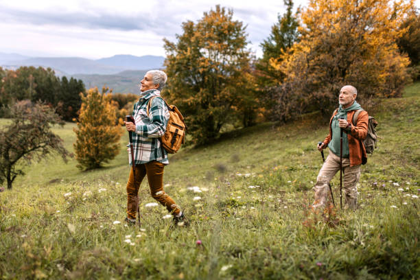 istock Senior couple climbing hill together 1434234832