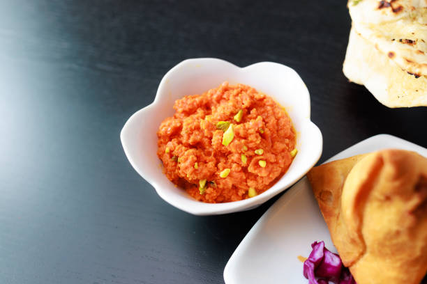Indian food, Gajar Halwa (Sweet Carrot Dessert) , Vegetable Samosas,\nShot with R5
