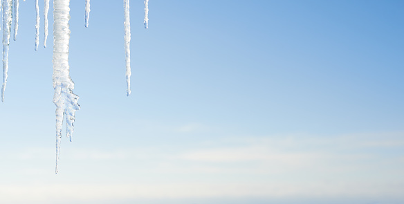 clear icicles against blue sky