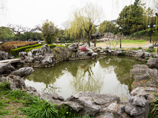 Traditional Chinese garden with pond in springtime
