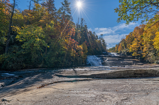 Beautiful fall foliage around Triple Falls in DuPont State Recreational Forest near Asheville North Carolina USA