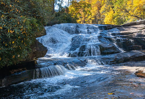 Beautiful fall foliage around Triple Falls in DuPont State Recreational Forest near Asheville North Carolina USA