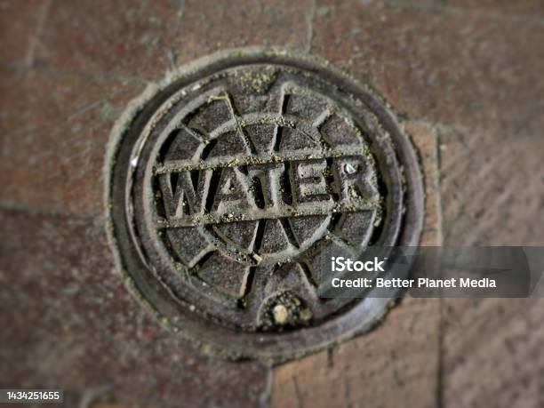 City Water Utility Cover Stock Photo - Download Image Now - Brick, Brown, Circle