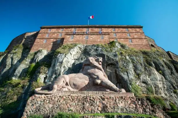 A closeup of the Lion de Bartholdi sculpture in Belfort, France.