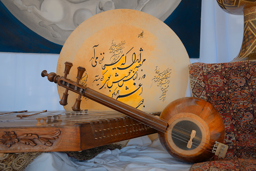 Persian musical instruments on a decorative background