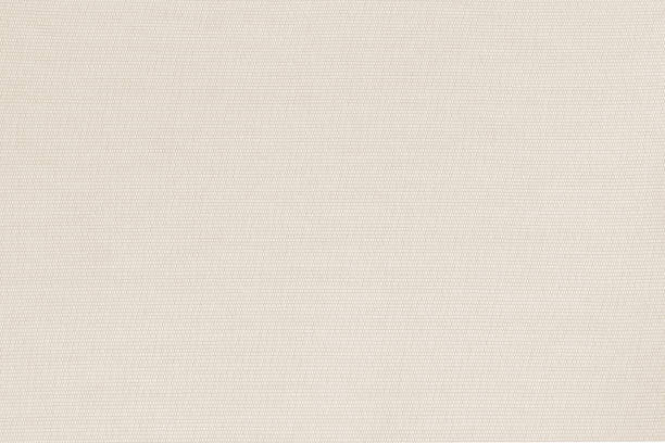 istock Beige silk cotton fabric wallpaper texture background in light white cream 1434262270
