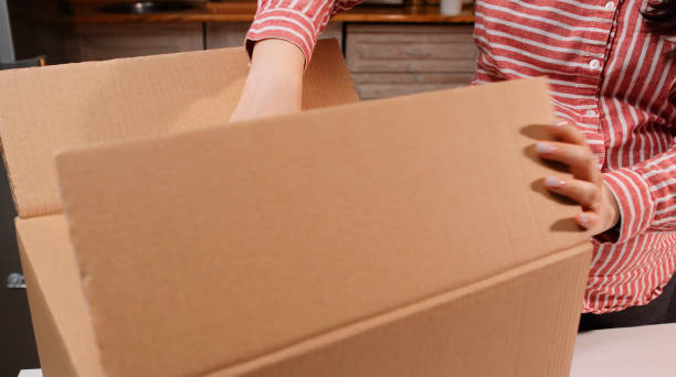 istock Pregnant woman preparing donation boxes. Charity. 1434265521