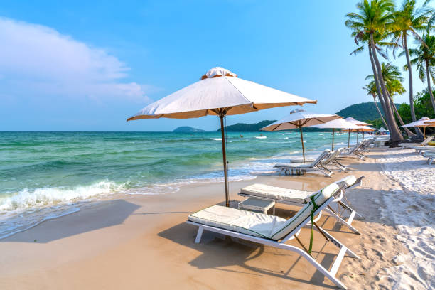 Sunbeds on tropical beach in Phu Quoc island, Vietnam stock photo