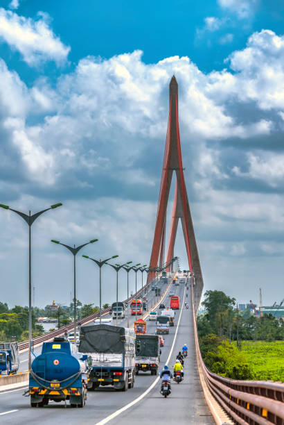 Can Tho, Vietnam - April 21st, 2022: Heavy traffic on Can Tho bridge on summer afternoon . Can Tho bridge is famous bridge in mekong delta, Vietnam.