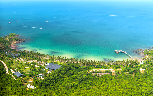 Nice beach in Phu Quoc island Vietnam. The bay with blue water, coconut trees, and fine sand is considered a beautiful beach in the Gulf of Thailand