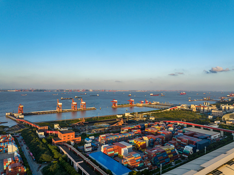 Shanghai,China-October 13,2022:aerial view of container ship leaving at Shanghai Waigaoqiao port.