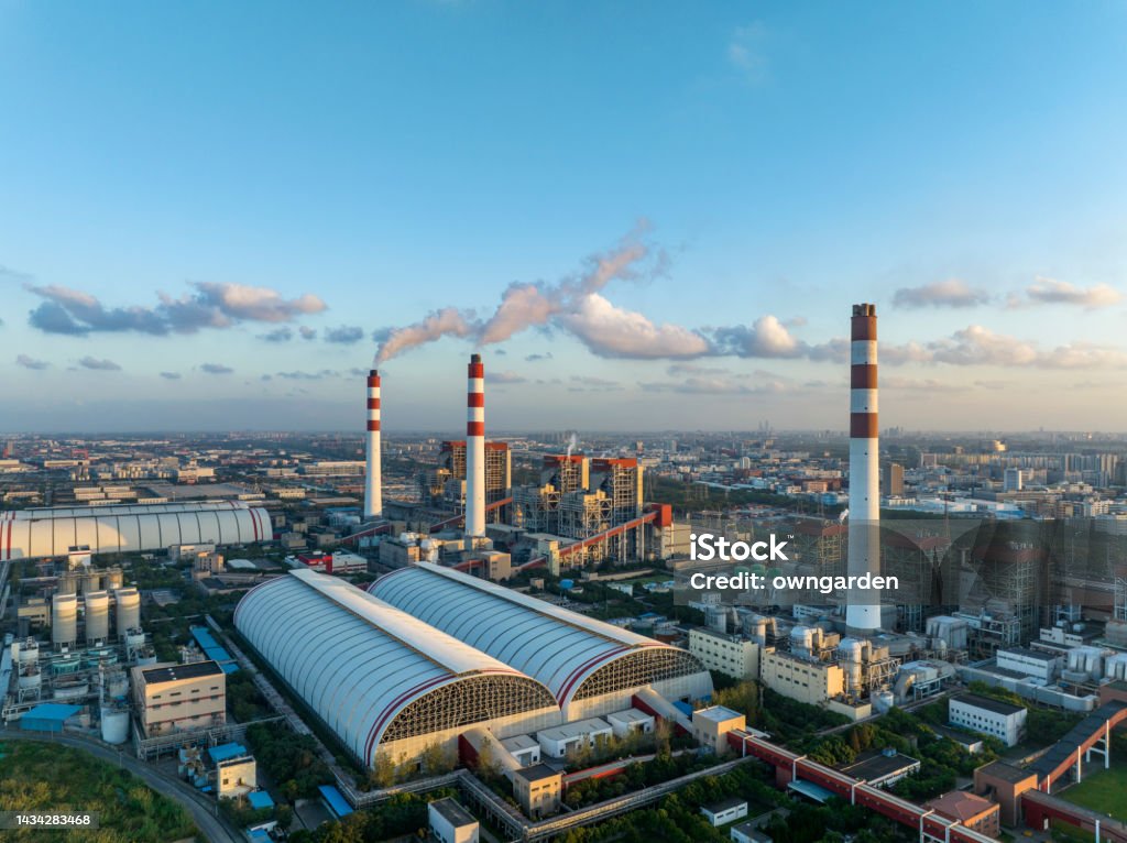 Aerial view of thermal power generation at sunset Aerial view of Coal-fired power station,shanghai,china. Carbon Neutrality Stock Photo