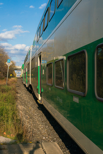 Passenger Train Approaching Station with People waiting to Board