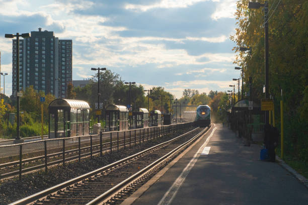 istock Passenger Train Approaching Station with People waiting to Board 1434288635
