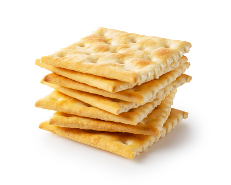 Crackers placed on top of each other on a white background.