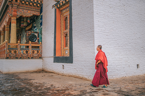 Thimphu, Bhutan - October 7: Bhutanese Monk walking in Punakha Dzong on October 7, 2022 in Punakha, Bhutan.