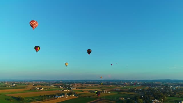 Drone View of a Multiple Hot Air Balloons Floating in the Sky During a Balloon Festival