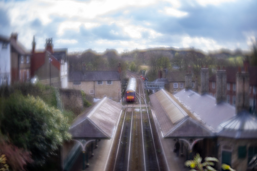 Railway station and commuter train in the town of Knaresborough in North Yorkshire. Taken with a Lensbaby to give the specific blurred effect to the image
