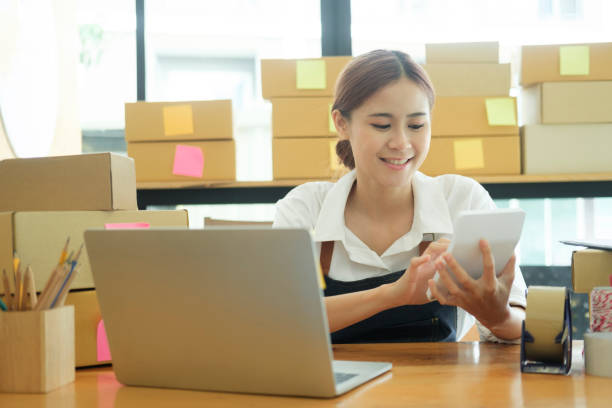 istock Female online business owner using calcolator calculating financial expense. 1434297973