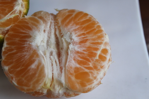 peeled oranges on a plate