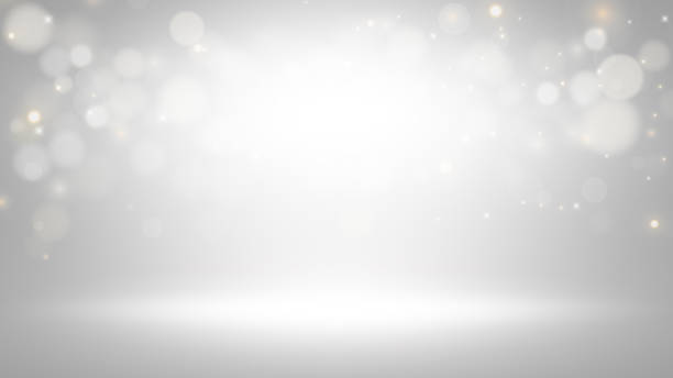 Empty dark gray room with gradient gray background and Abstract white bokeh lights effect background.