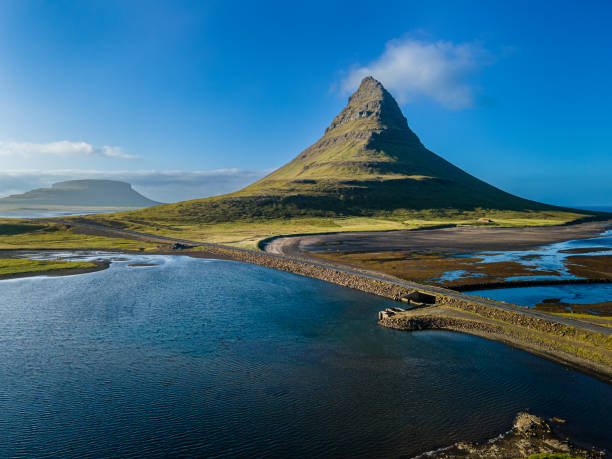 Beautiful aerial view of the Kirkjufell high mountain in Iceland, on the Snæfellsnes peninsula Beautiful aerial view of the Kirkjufell high mountain in Iceland, on the Snæfellsnes peninsula kirkjufell stock pictures, royalty-free photos & images