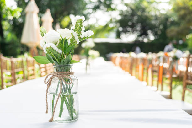 istock Flower arrangements on Wedding table that decorated. Beautiful wedding bouquets on a table 1434307634