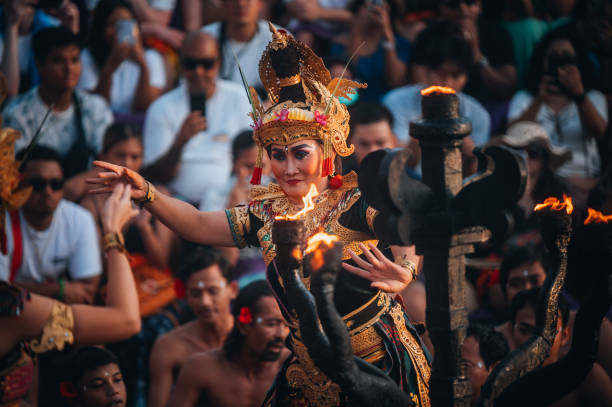 Uluwatu Bali, Indonesia - October  16, 2022:Traditional Balinese Kecak Dance at Uluwatu Temple in Bali, Indonesia. Kecak also known as Ramayana Monkey Chant, is very popular cultural show on Bali.