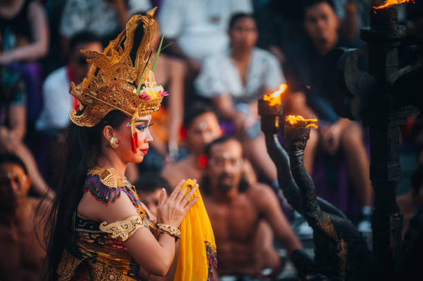 Kecak Fire Dance at Uluwatu Temple, Bali, Indonesia Uluwatu Bali, Indonesia - October  16, 2022:Traditional Balinese Kecak Dance at Uluwatu Temple in Bali, Indonesia. Kecak also known as Ramayana Monkey Chant, is very popular cultural show on Bali. ceremonial dancing stock pictures, royalty-free photos & images
