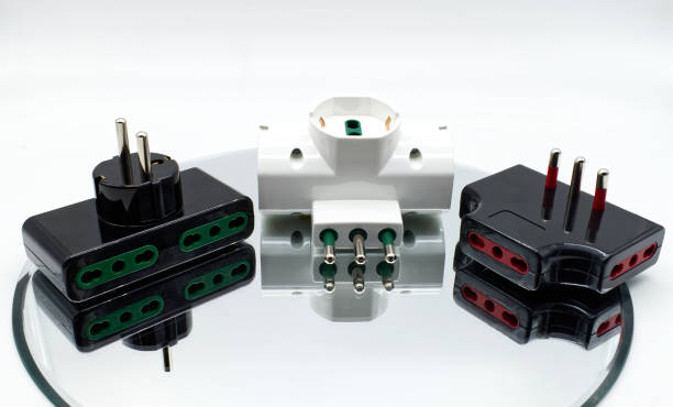 istock Electrical socket adaptors. Connecting devices to home power isolated on white 1434316661