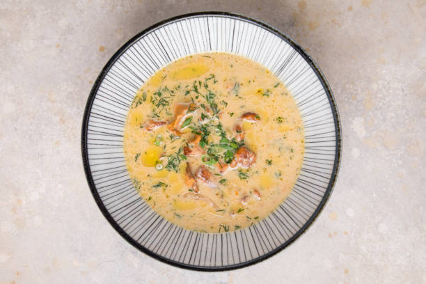 istock Corn chowder soup in white bowl on concrete background. 1434317516