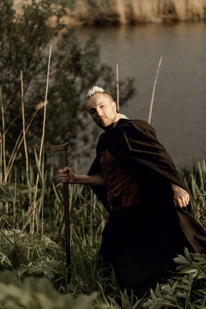 istock A young man with an interesting depicts a Viking with an ax in an unreliable stylized modern costume 1434320194